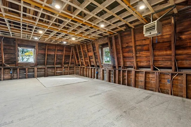 a view of an empty room with wooden walls