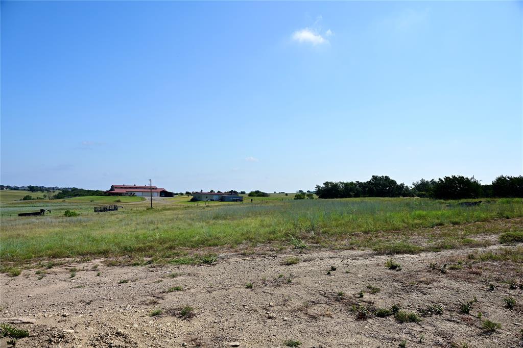 Lot 34 Colt Road Springtown, TX 76082 - Photo 2 of 13 a view of a field with trees in background