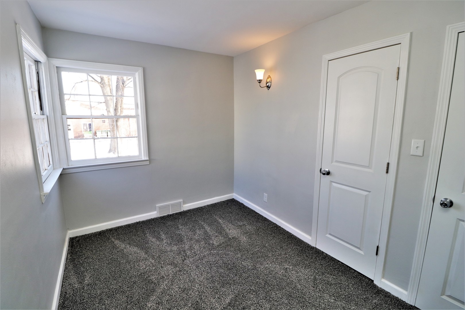 913 North Main Street Rochelle, IL 61068 - Photo 12 of 33 an empty room with windows