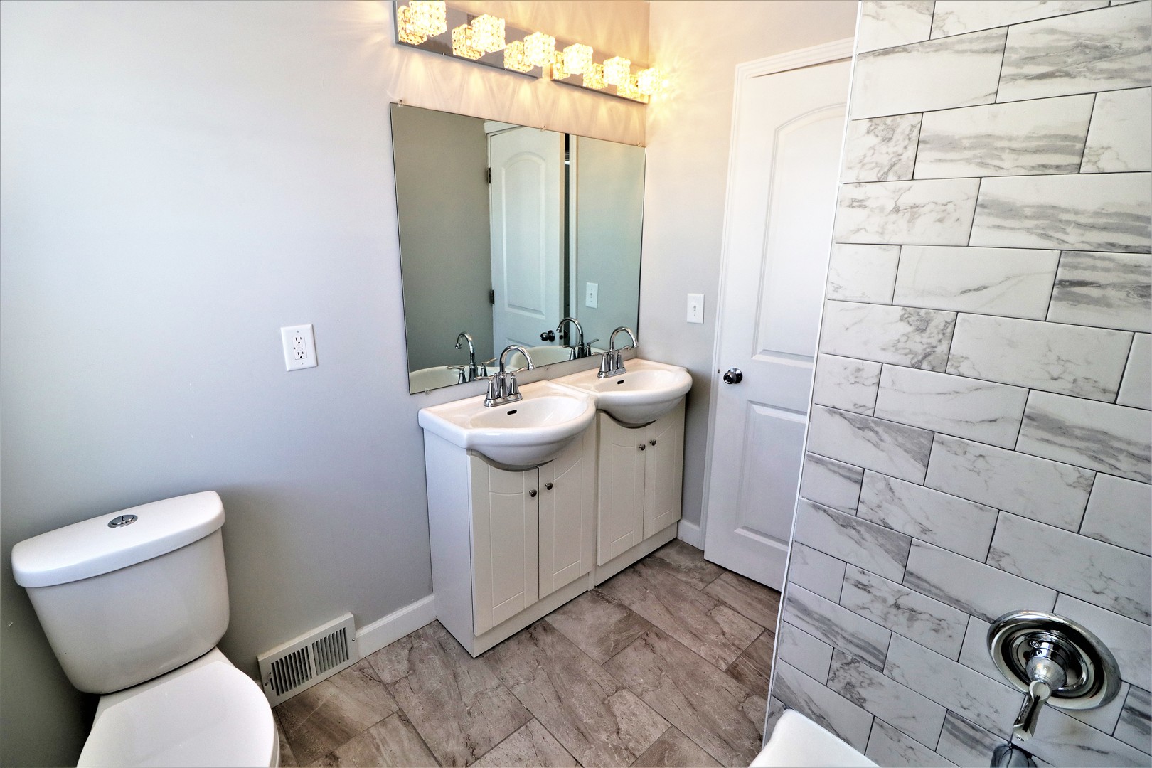 913 North Main Street Rochelle, IL 61068 - Photo 21 of 33 a bathroom with a sink toilet and shower