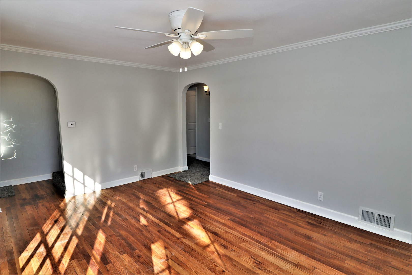 913 North Main Street Rochelle, IL 61068 - Photo 5 of 33 wooden floor in an empty room with a window