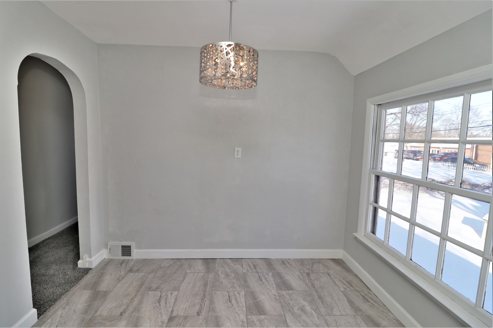 913 North Main Street Rochelle, IL 61068 - Photo 10 of 33 a view of an empty room with a window