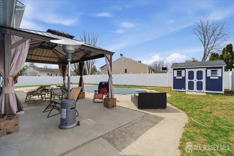 a view of swimming pool with outdoor seating