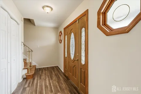 a view of a door with wooden floor