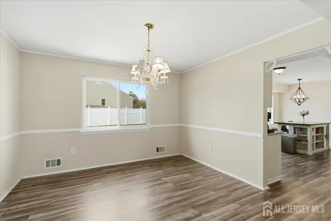 a view of a livingroom with wooden floor