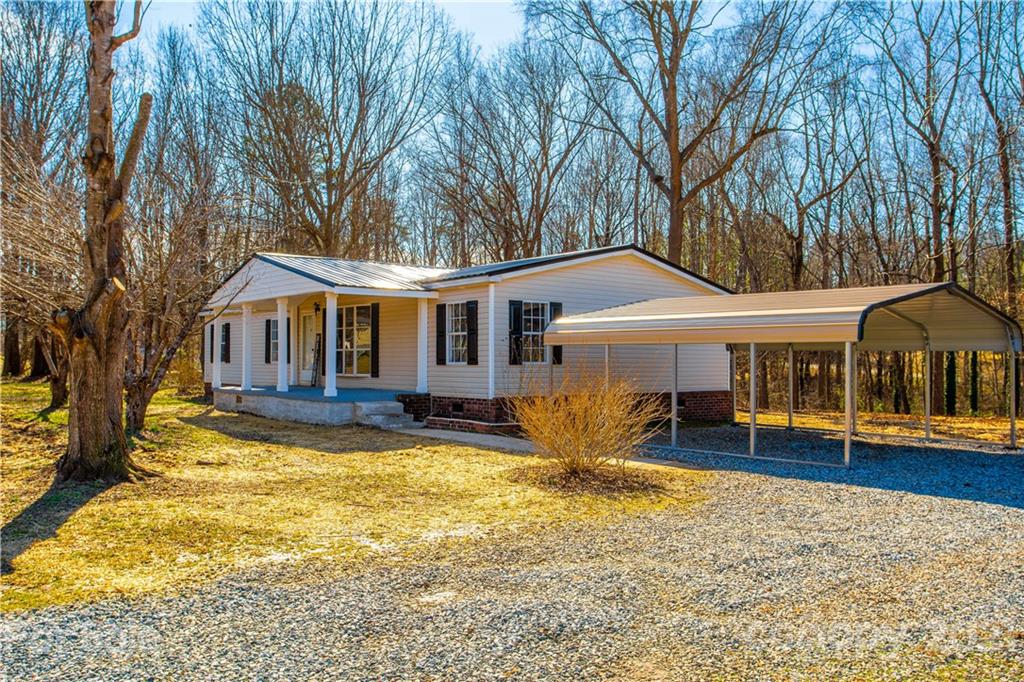 216 Cindy Road Salisbury, NC 28147 - Photo 3 of 34 a view of a house with a yard patio and fire pit