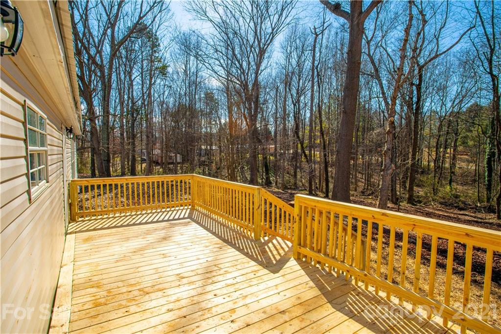 216 Cindy Road Salisbury, NC 28147 - Photo 7 of 34 a view of balcony with wooden floor and fence