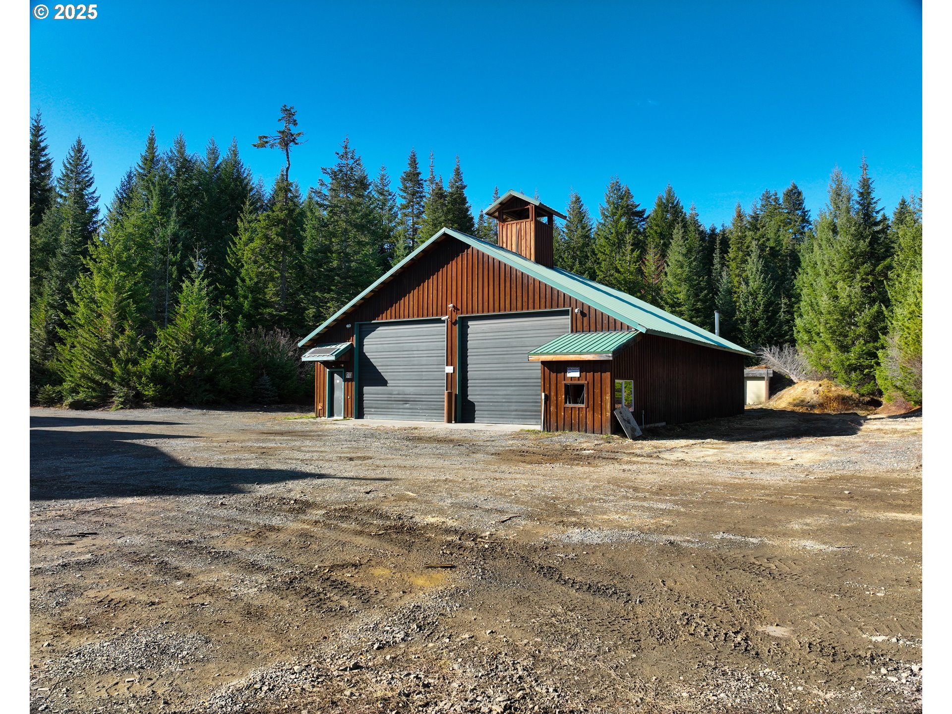 267 Usfs 86 Road Trout Lake, WA 98650 - Photo 18 of 32 a house with trees in the background