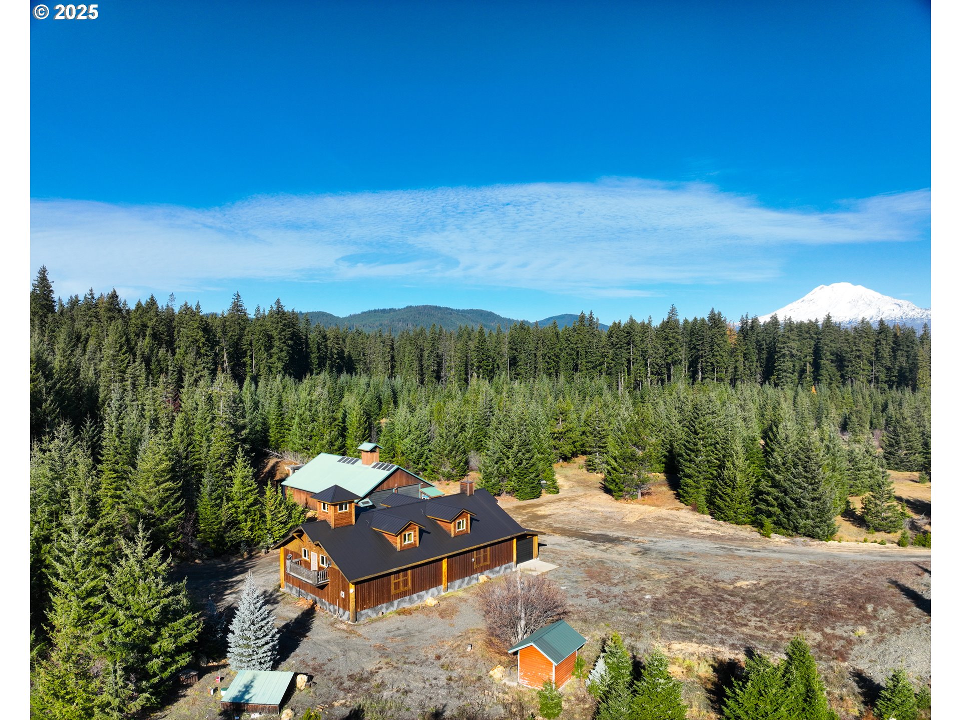 267 Usfs 86 Road Trout Lake, WA 98650 - Photo 28 of 32 a view of a lake with couches in the patio