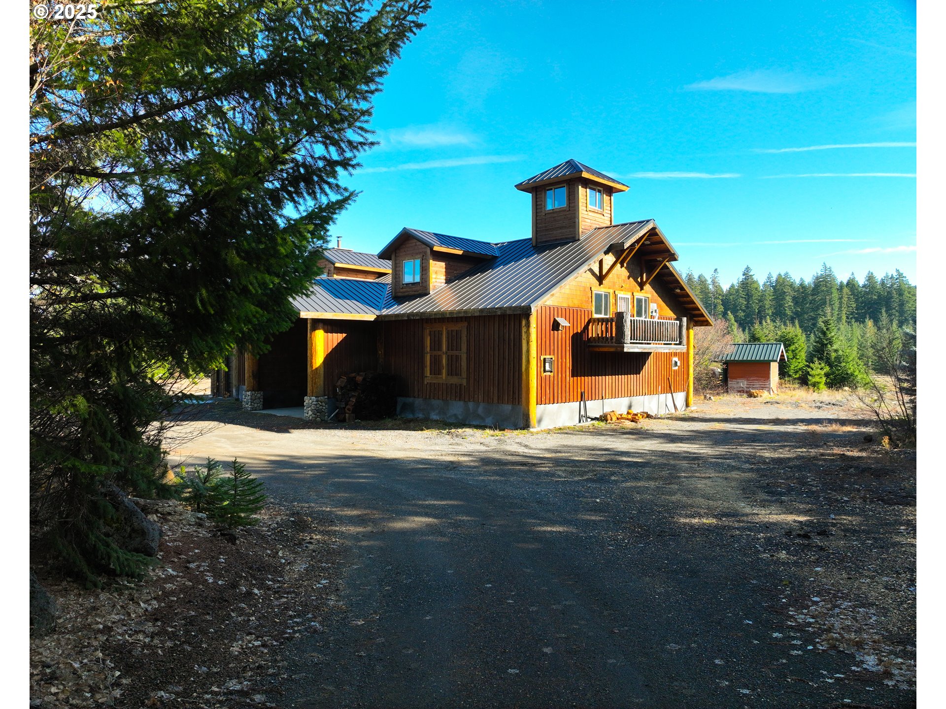267 Usfs 86 Road Trout Lake, WA 98650 - Photo 30 of 32 a front view of a house with a yard and garage