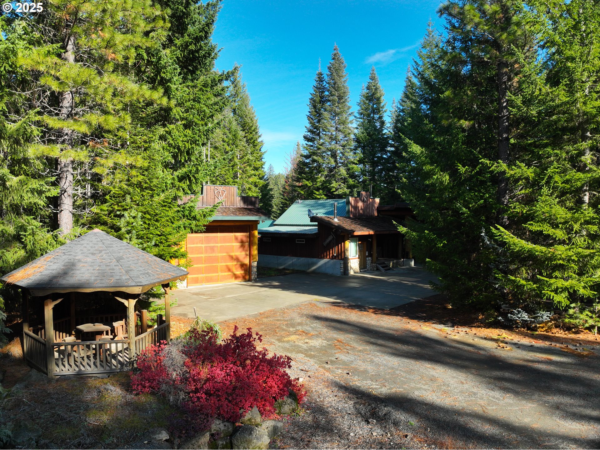 267 Usfs 86 Road Trout Lake, WA 98650 - Photo 6 of 32 a view of a patio with table and chairs and potted plants