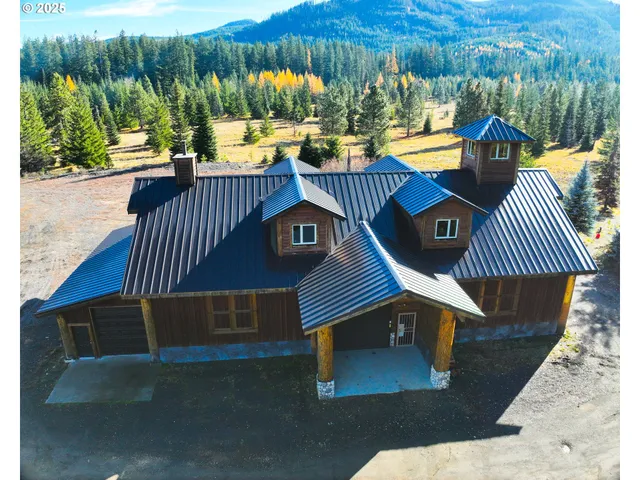 a view of a patio with table and chairs with wooden floor and fence