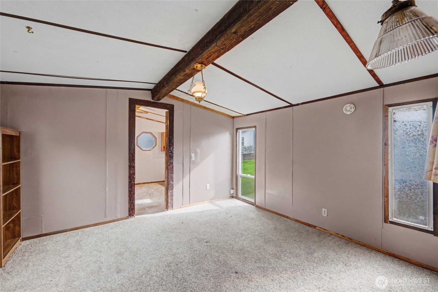 4672 Birch Bay Lynden Road, Unit 157 Blaine, WA 98230 - Photo 16 of 27 a view of a room with large windows