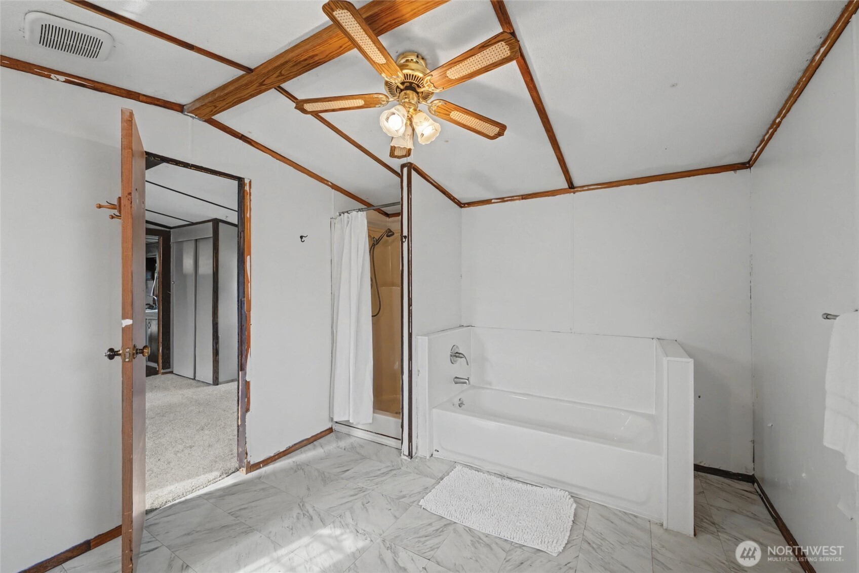 4672 Birch Bay Lynden Road, Unit 157 Blaine, WA 98230 - Photo 20 of 27 a bathroom with a shower and a sink