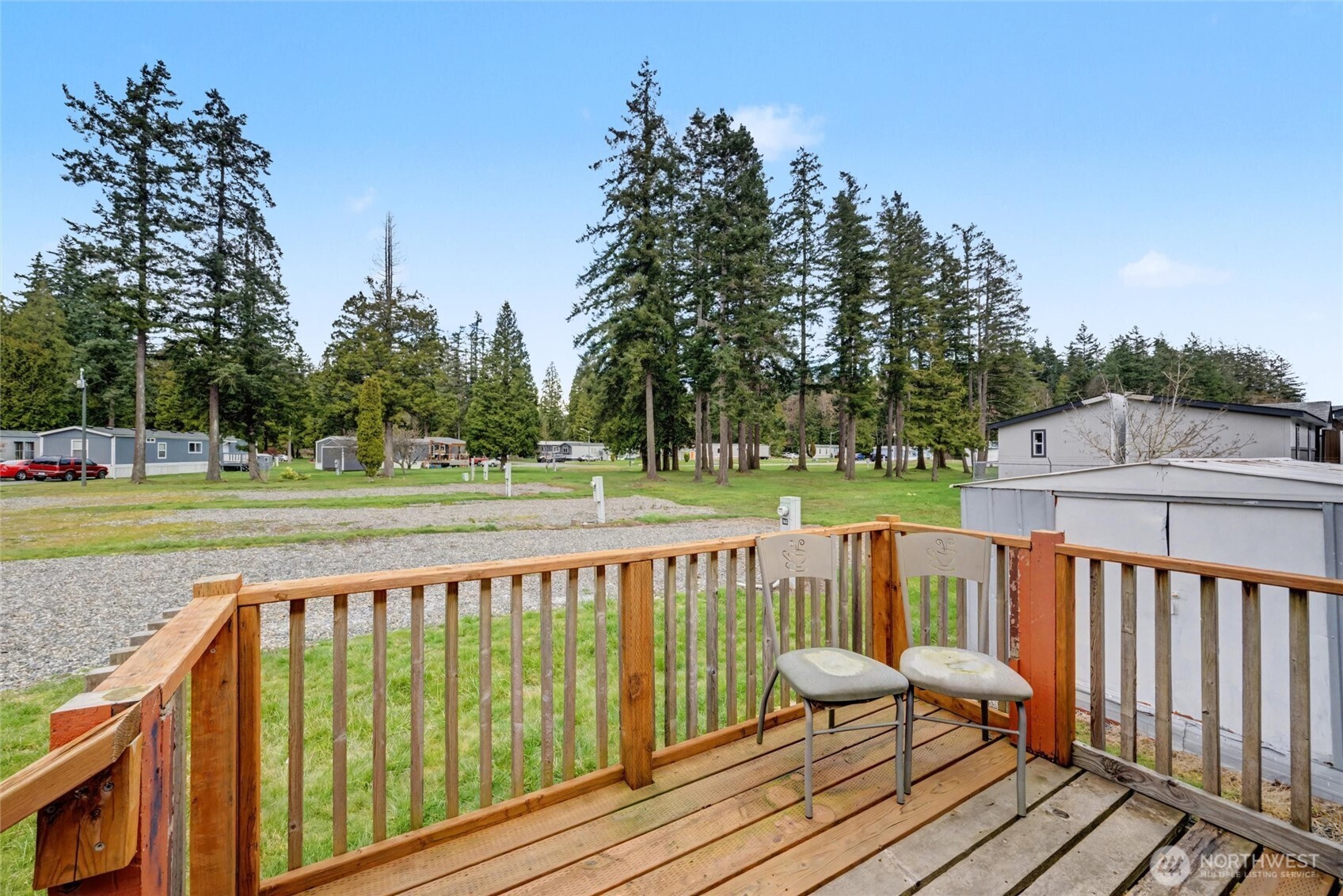 4672 Birch Bay Lynden Road, Unit 157 Blaine, WA 98230 - Photo 2 of 27 a view of balcony with wooden floor and fence