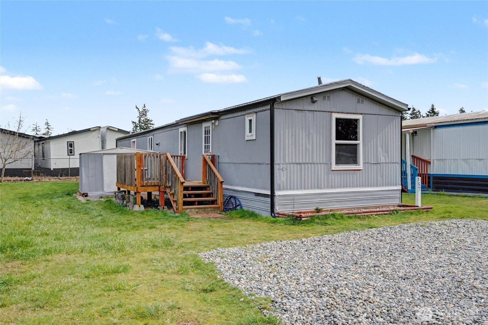 4672 Birch Bay Lynden Road, Unit 157 Blaine, WA 98230 - Photo 3 of 27 a view of a house with a yard