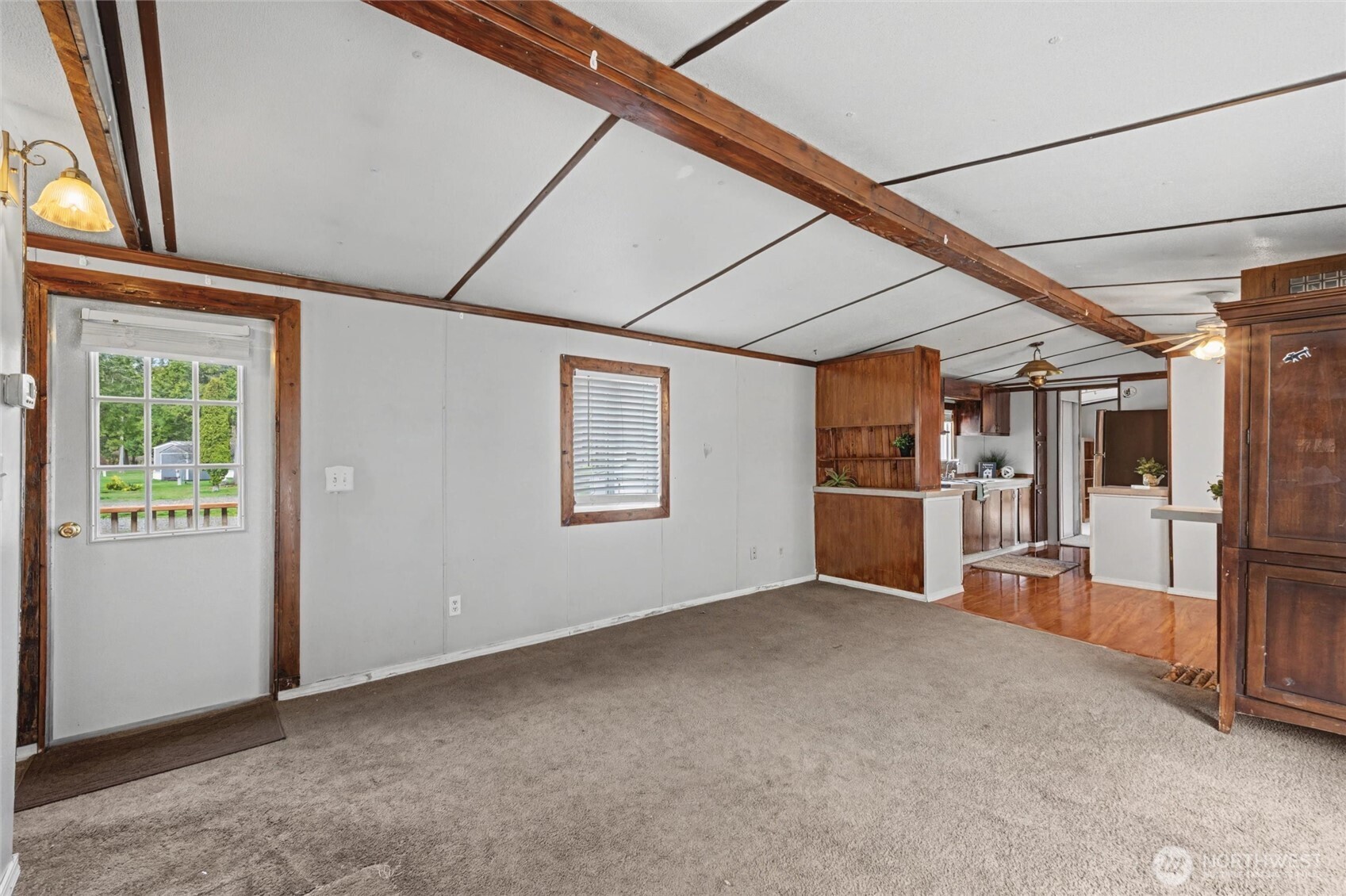 4672 Birch Bay Lynden Road, Unit 157 Blaine, WA 98230 - Photo 4 of 27 a view of empty room with wooden floor and windows
