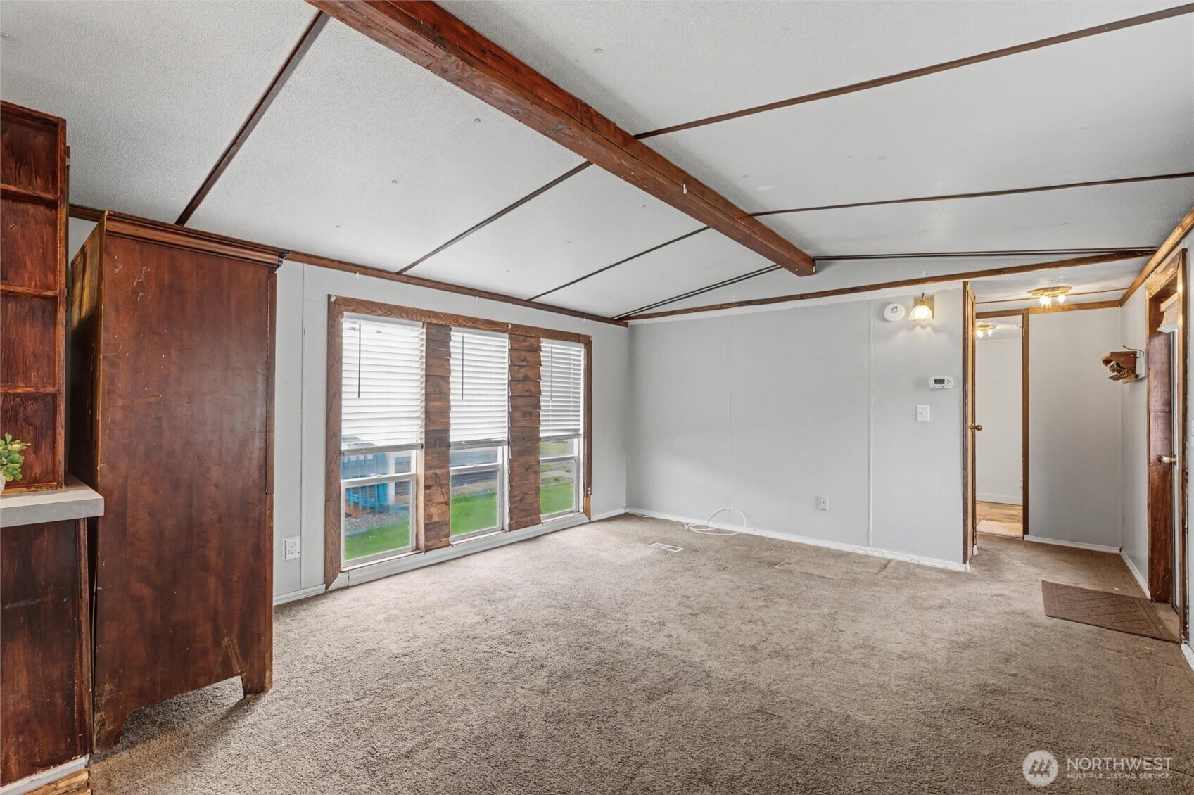 4672 Birch Bay Lynden Road, Unit 157 Blaine, WA 98230 - Photo 6 of 27 a view of an empty room with a window