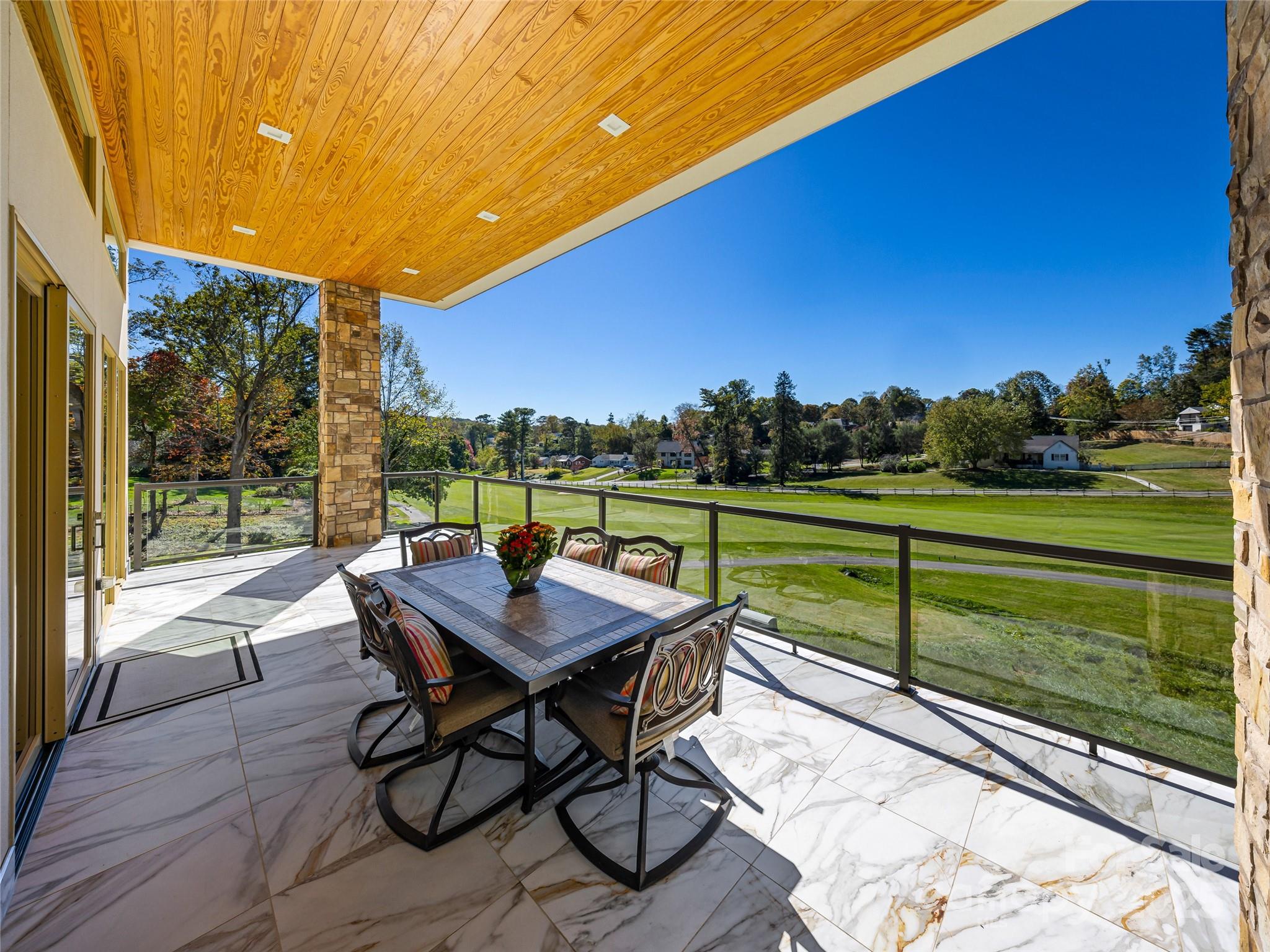 123 Wembley Road Asheville, NC 28804 - Photo 16 of 42 a view of a chairs and table in the balcony