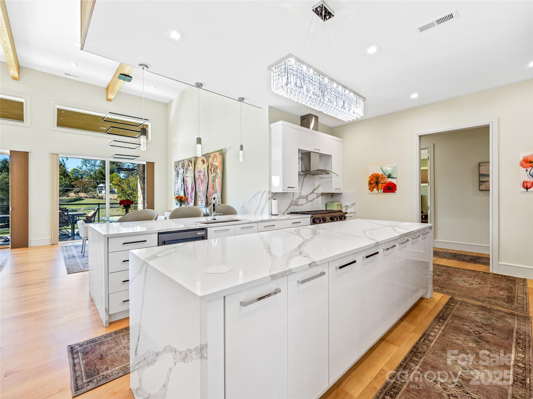 123 Wembley Road Asheville, NC 28804 - Photo 18 of 42 a large white kitchen with a large window