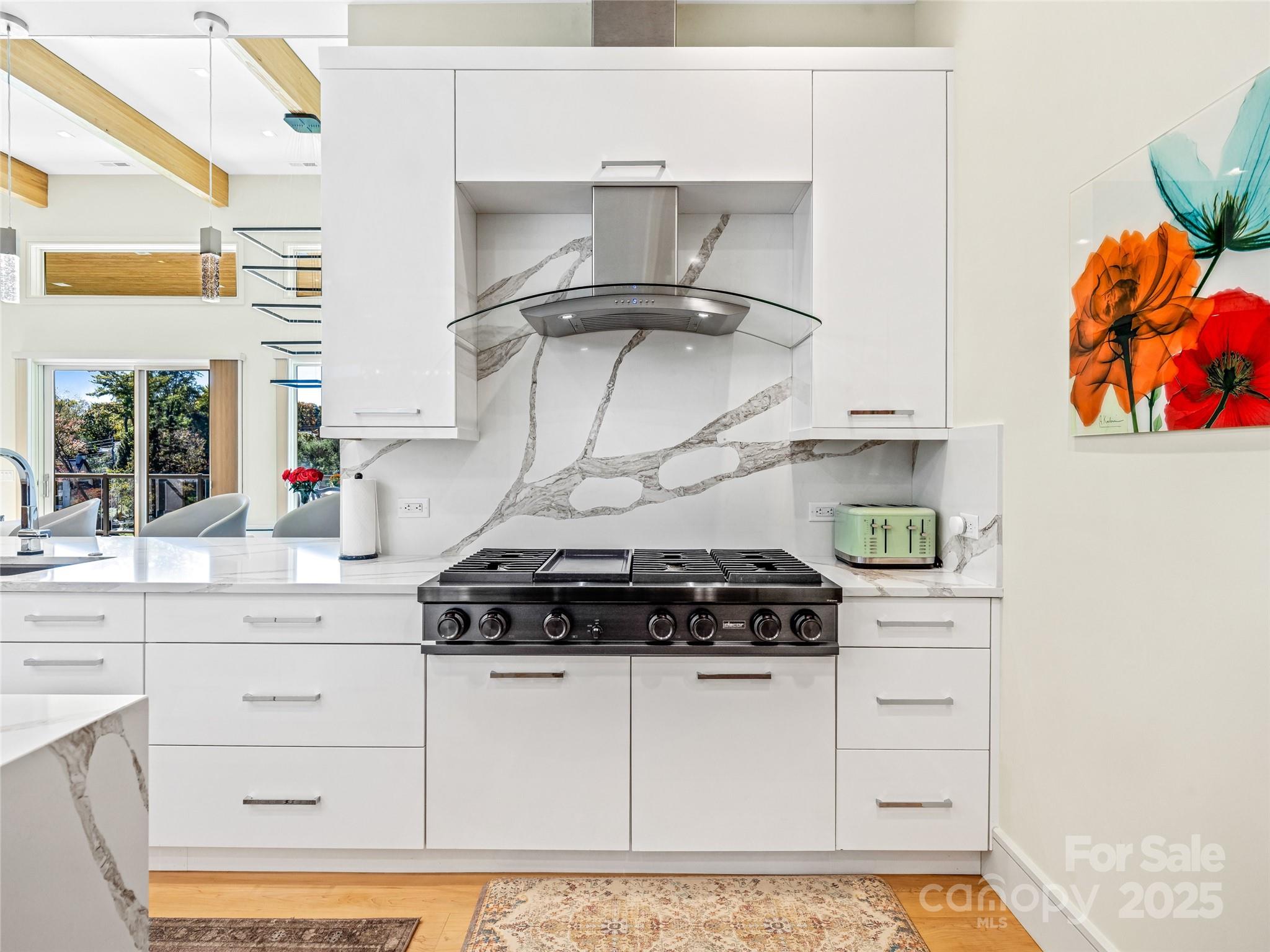 123 Wembley Road Asheville, NC 28804 - Photo 19 of 42 a kitchen with stainless steel appliances granite countertop a stove and a microwave