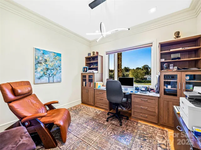 a work room with furniture and book shelf
