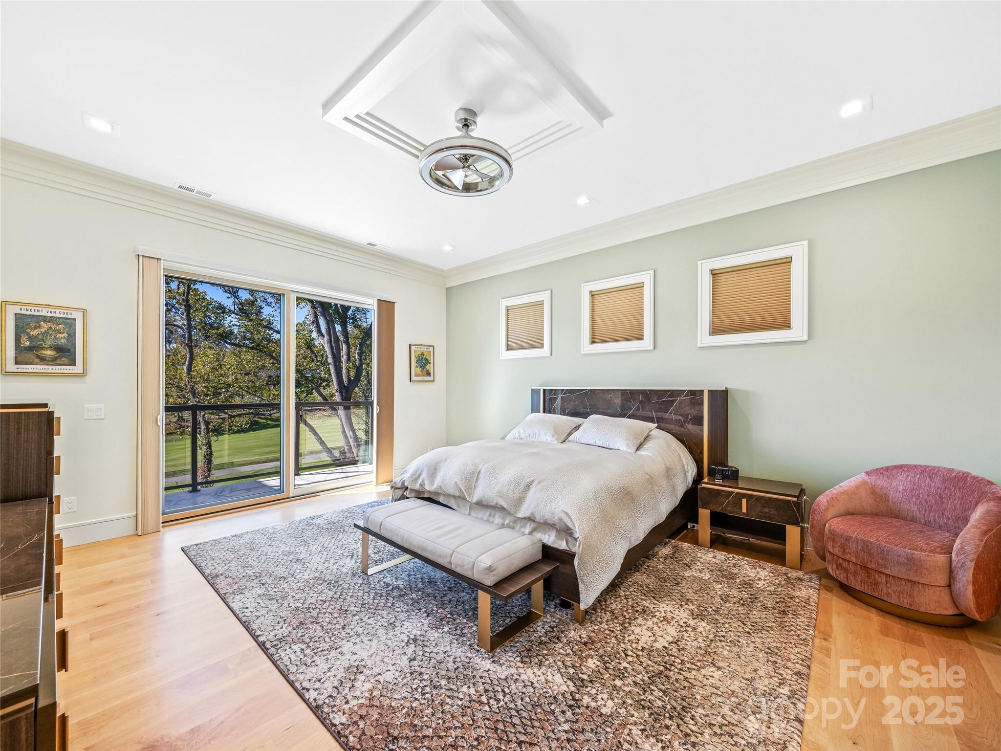 123 Wembley Road Asheville, NC 28804 - Photo 24 of 42 a spacious bedroom with a bed a couch and a large window