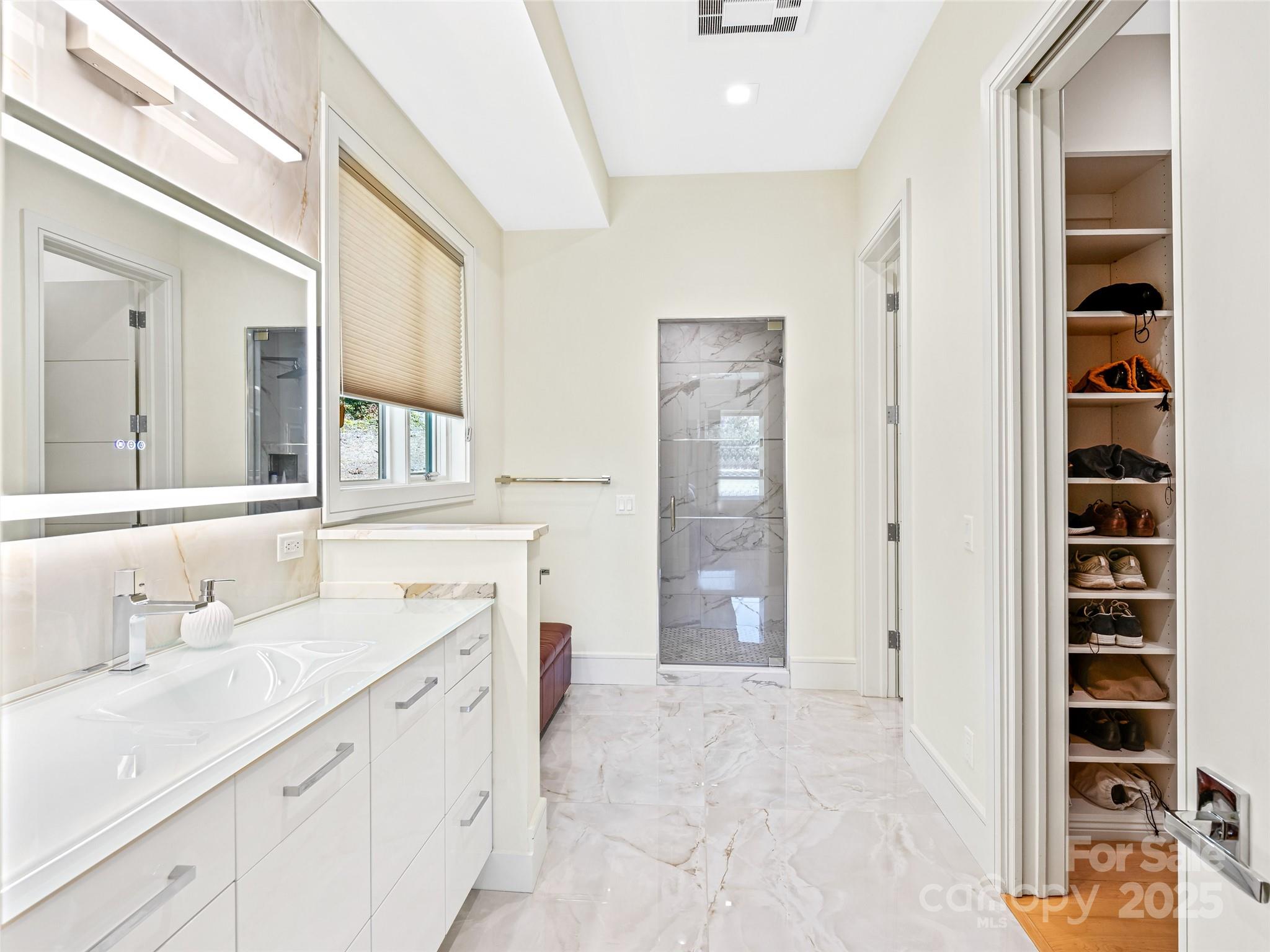 123 Wembley Road Asheville, NC 28804 - Photo 27 of 42 a bathroom with a sink and a mirror