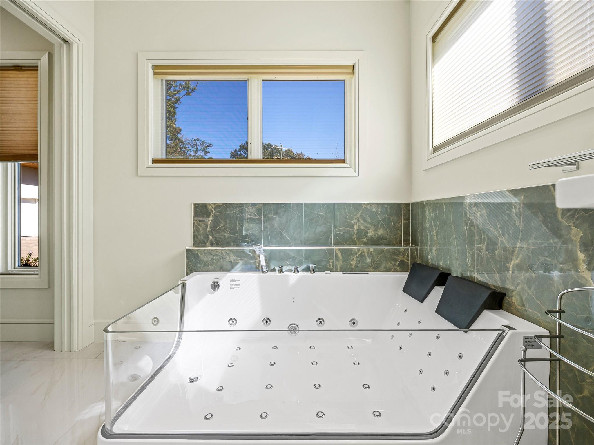 123 Wembley Road Asheville, NC 28804 - Photo 33 of 42 a bathroom with a bathtub and a shower