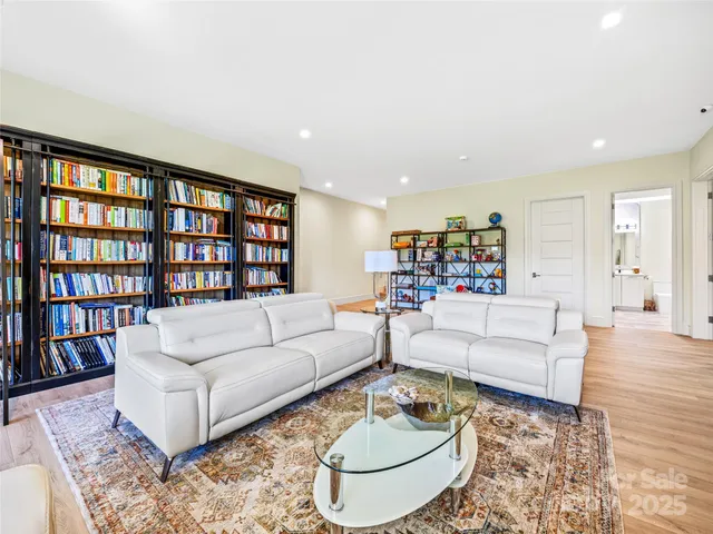 a living room with furniture and a table