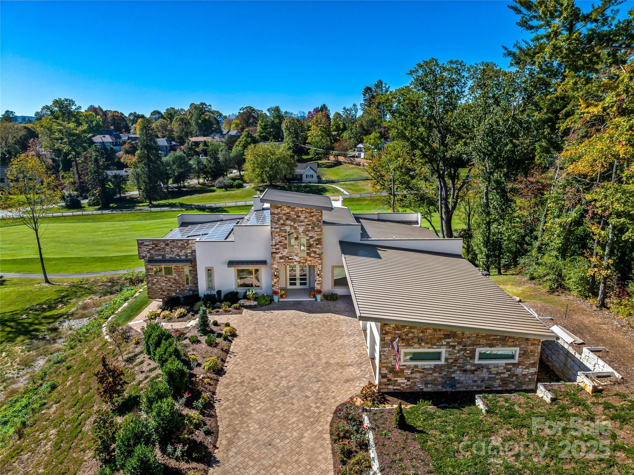 123 Wembley Road Asheville, NC 28804 - Photo 5 of 42 an aerial view of a house with a yard