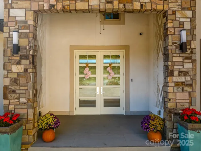 a view of a entryway with flower pots