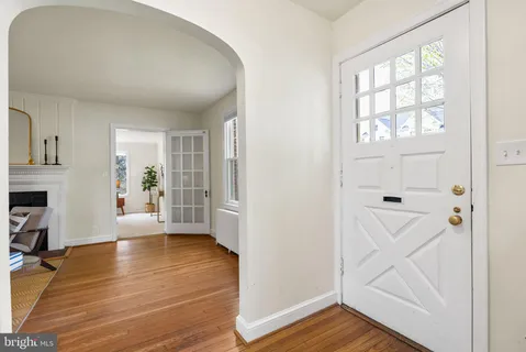 a view of an entryway with wooden floor