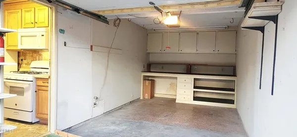 a view of a room that has a large window