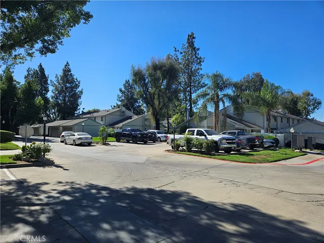 a view of street with parked cars