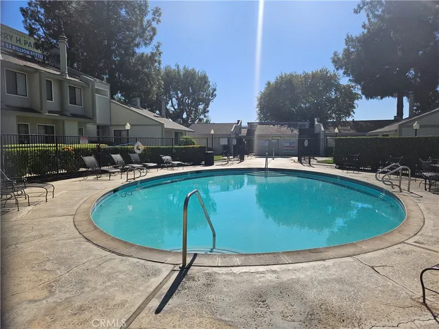 a view of a swimming pool with a patio