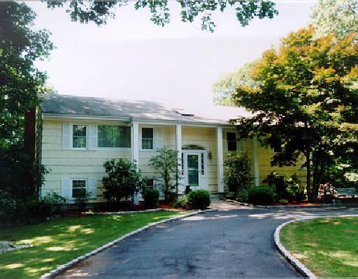 62 Winesap Road Stamford, CT 06903 - Photo 1 of 1 front view of a house with a yard
