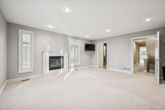 a view of an empty room with a fireplace