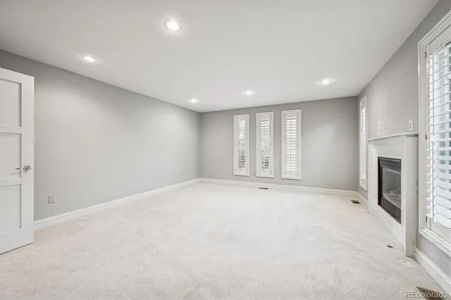 a bathroom with a granite countertop sink double vanity and a mirror