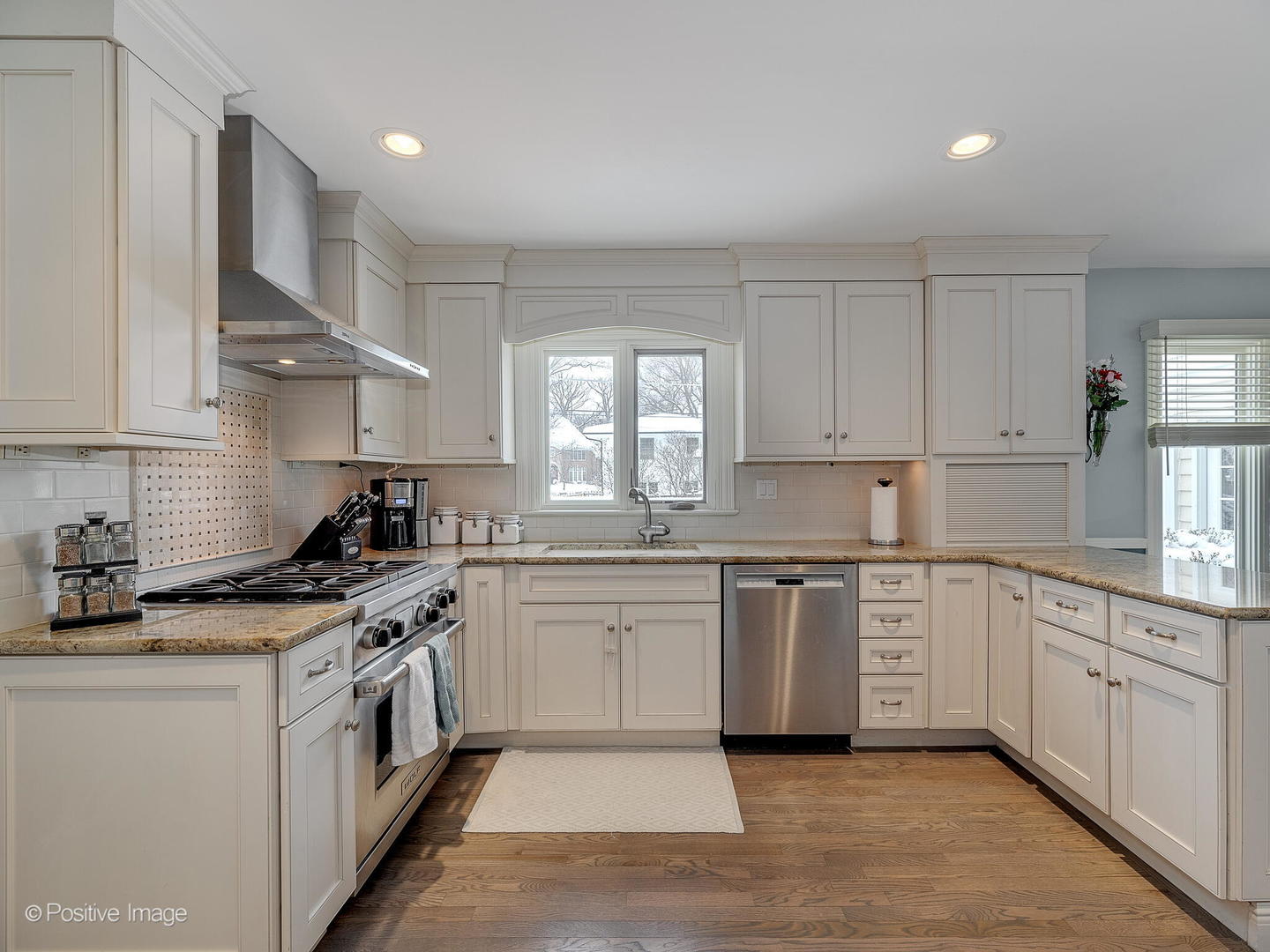 520 County Line Court Hinsdale, IL 60521 - Photo 12 of 33 a kitchen with a sink white cabinets and white appliances