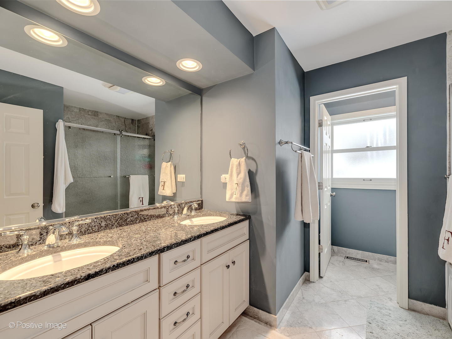 520 County Line Court Hinsdale, IL 60521 - Photo 21 of 33 a bathroom with double vanity sinks and a large mirror