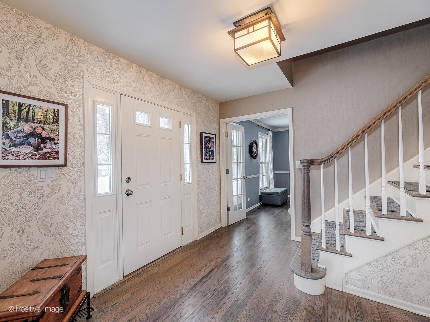 520 County Line Court Hinsdale, IL 60521 - Photo 3 of 33 a view of a hallway with wooden floor and staircase