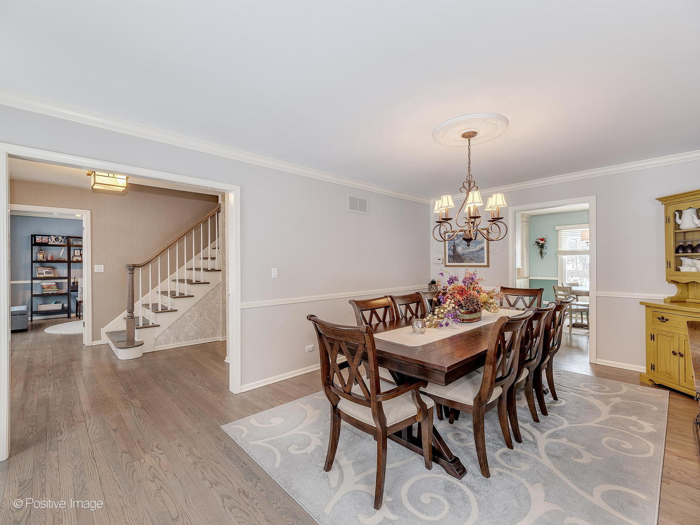 520 County Line Court Hinsdale, IL 60521 - Photo 4 of 33 a view of a dining room and livingroom with furniture wooden floor a chandelier