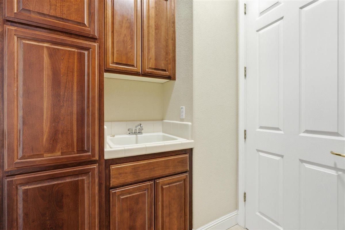 4129 Poppleton Way Carmichael, CA 95608 - Photo 25 of 48 a bathroom with a sink and cabinets