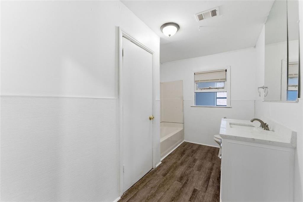 1431 Sharon Street Northwest Atlanta, GA 30314 - Photo 16 of 44 a bathroom with a sink toilet and shower