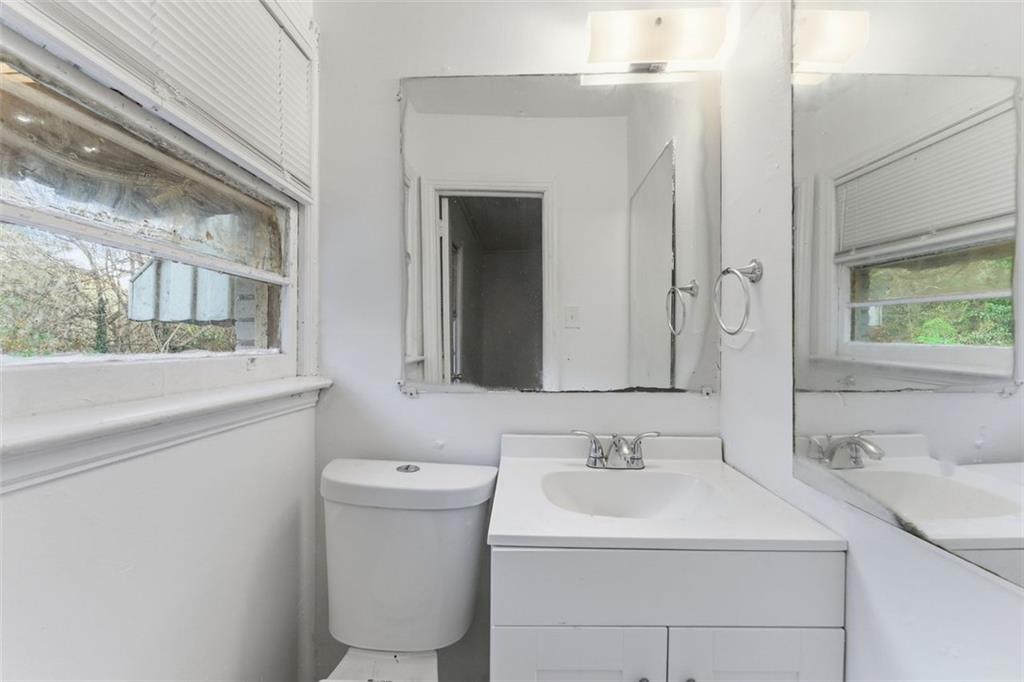 1431 Sharon Street Northwest Atlanta, GA 30314 - Photo 19 of 44 a bathroom with a sink and a mirror