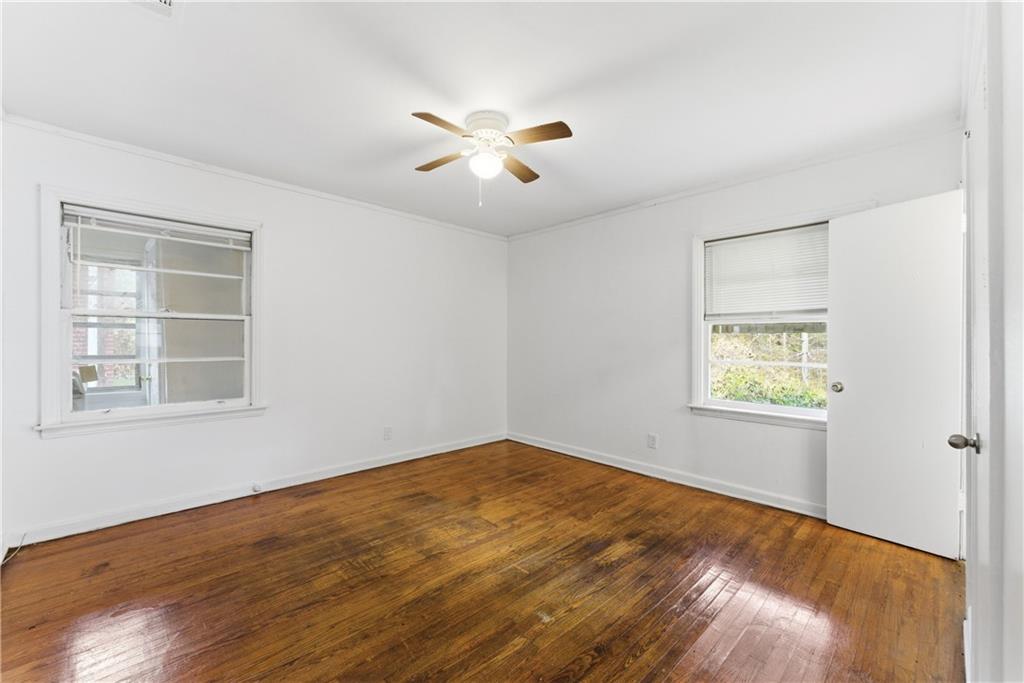 1431 Sharon Street Northwest Atlanta, GA 30314 - Photo 31 of 44 a view of empty room with wooden floor and fan