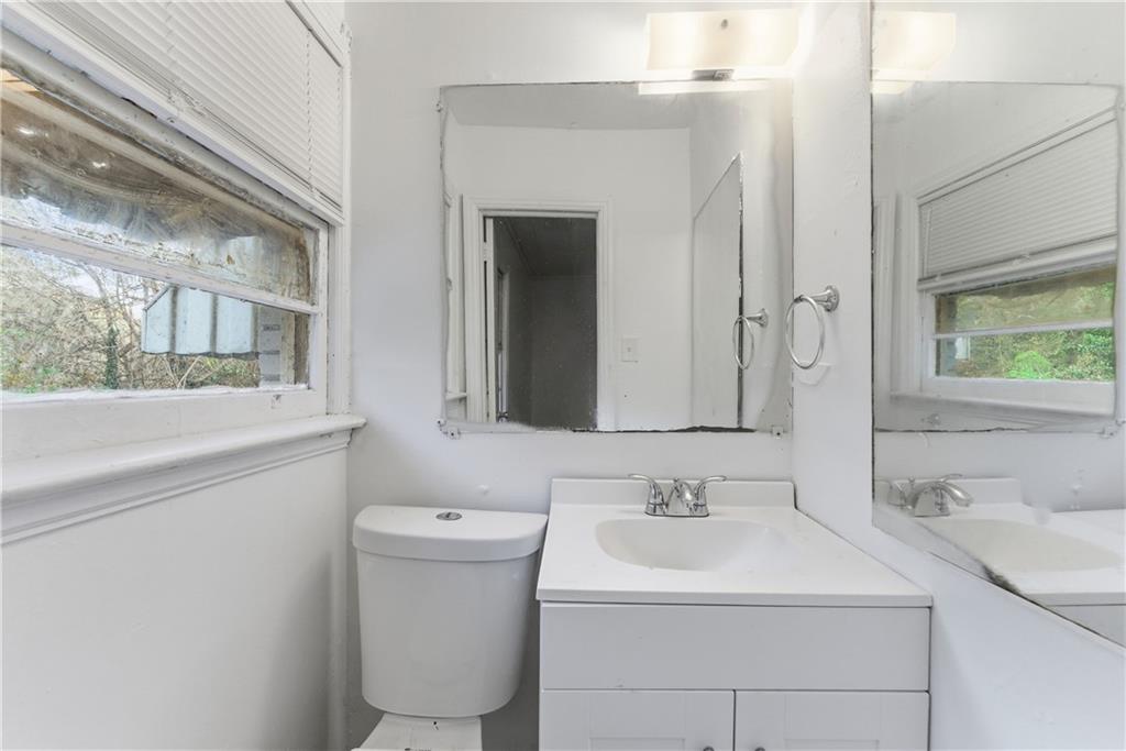 1431 Sharon Street Northwest Atlanta, GA 30314 - Photo 33 of 44 a bathroom with a sink and a mirror