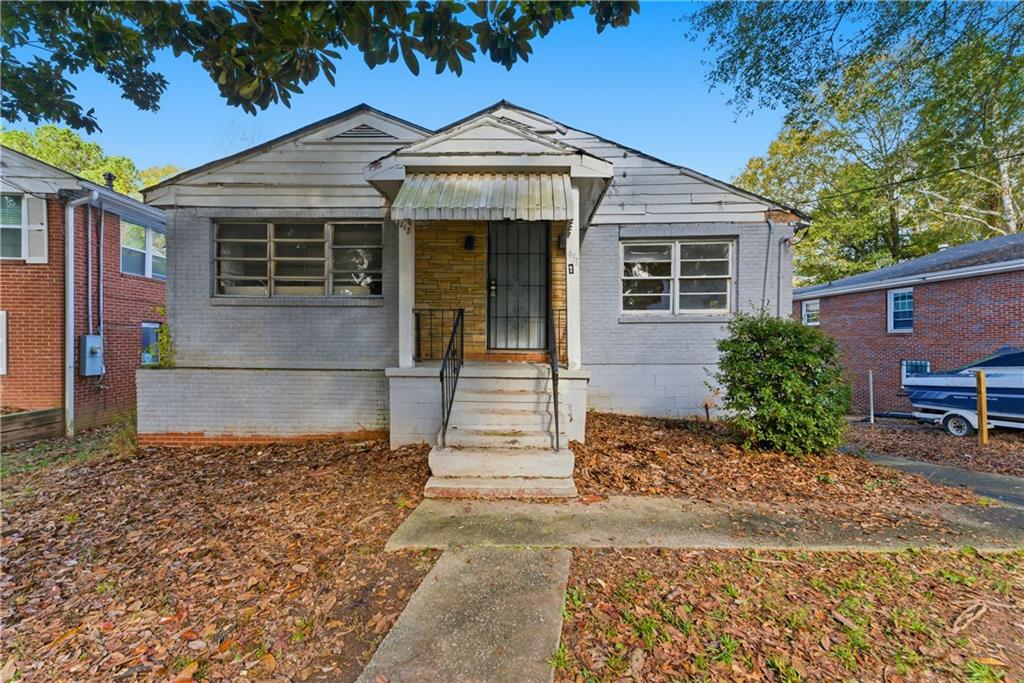 1431 Sharon Street Northwest Atlanta, GA 30314 - Photo 34 of 44 a front view of a house with garden