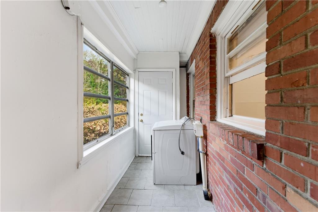 1431 Sharon Street Northwest Atlanta, GA 30314 - Photo 35 of 44 a bathroom with a bathtub and next to a window